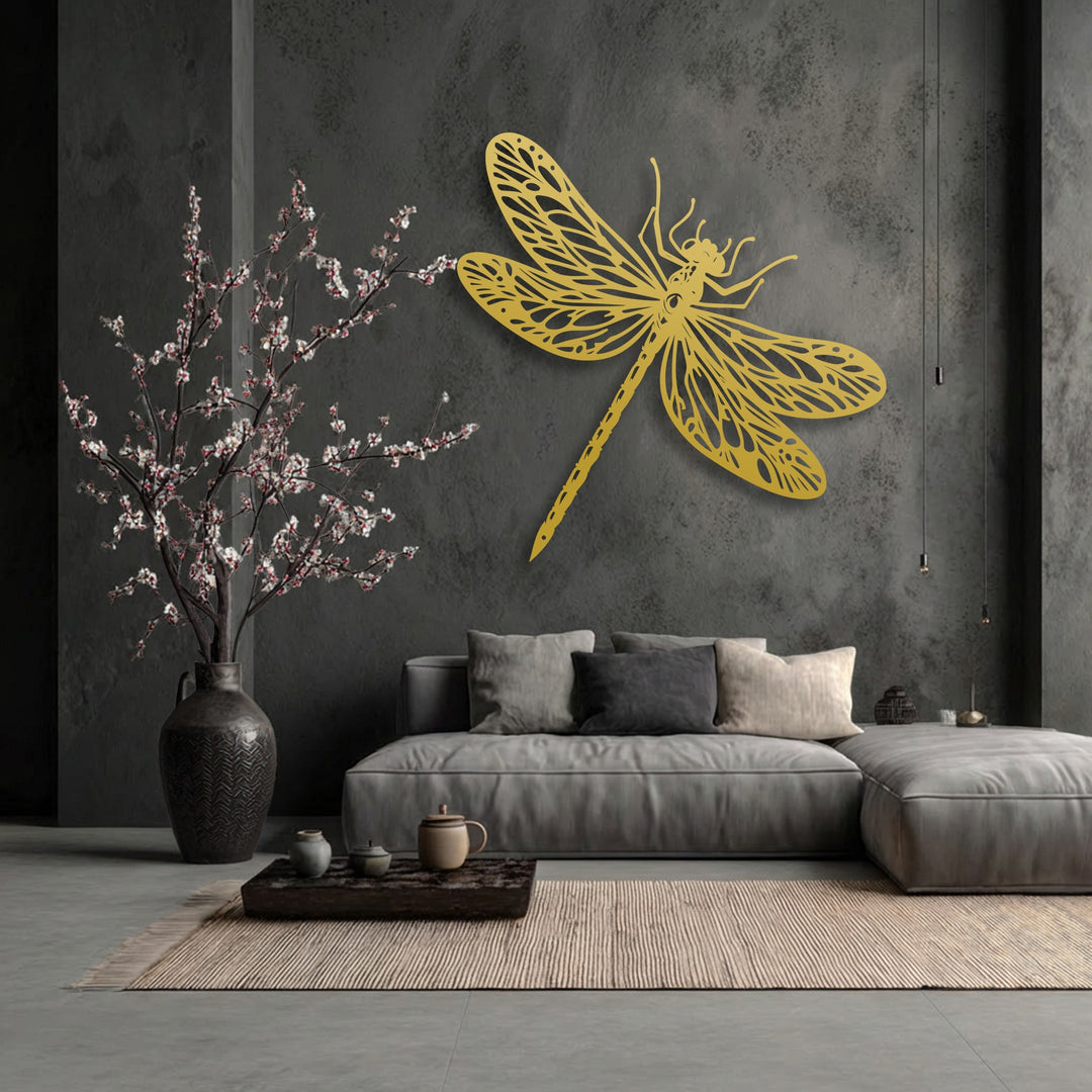 Charcoal gray walls provide a dramatic backdrop for the golden, intricate dragonfly decorative metal art, enhancing the modern living space.
