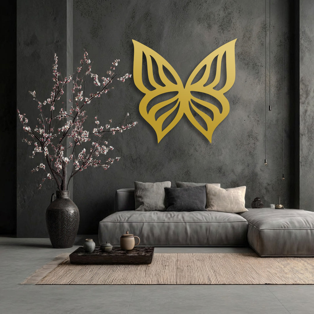 The dark gray, textured concrete wall serves as a stunning backdrop for the elegant golden butterfly silhouette metal wall decor.