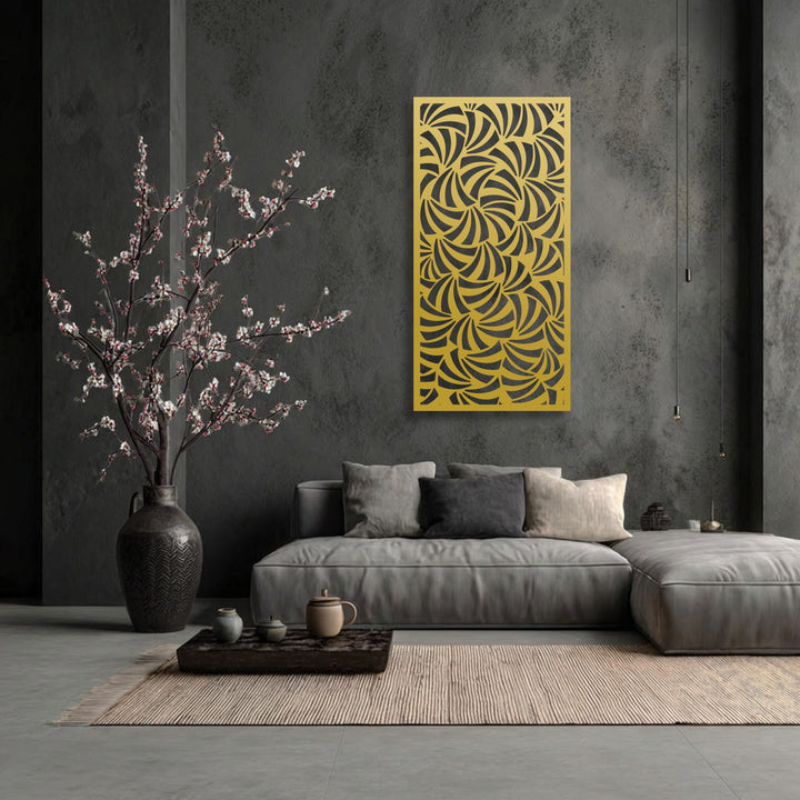 The focal point is a striking golden metal artwork panel featuring an intricate abstract geometric spiral pattern against a dark, textured wall.
