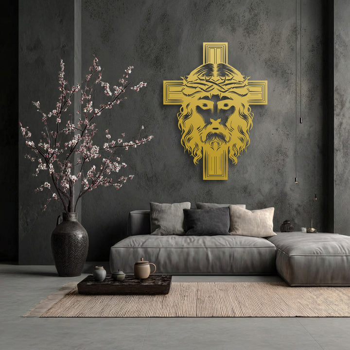 Flowing organic forms of a blossoming tree and Christ's hair on a golden sacred cross metal decoration wall art enhance the serene room.