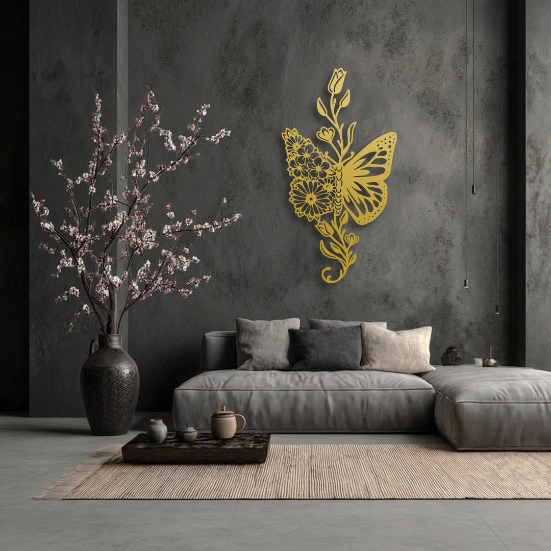 Organic forms of a golden floral butterfly metal artwork beautifully adorn a dark wall, embodying elegant nature.