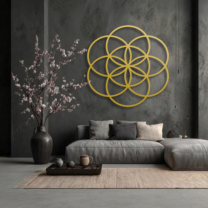 The intricate Flower of Life geometric metal decoration wall art creates dynamic depth and visual layers against the dark textured wall.