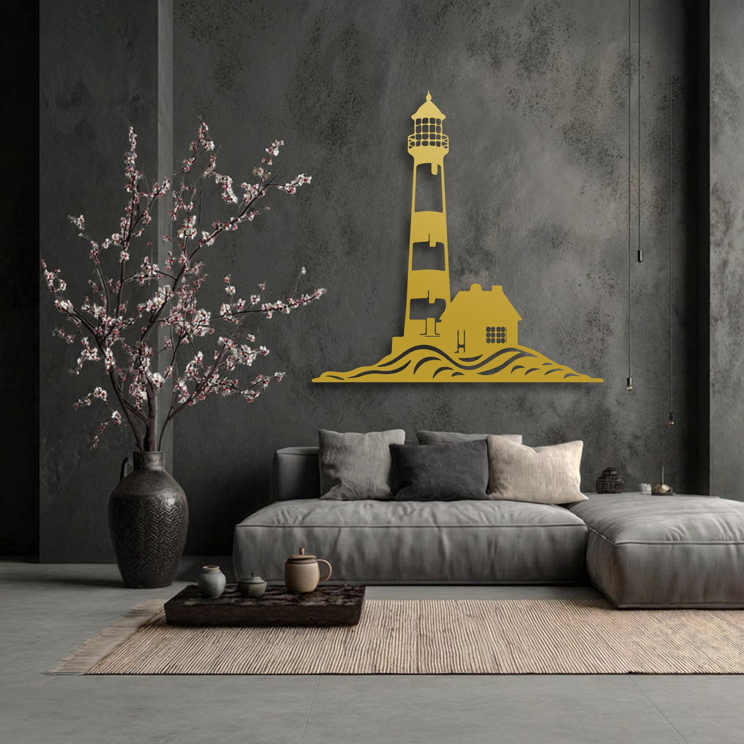 The textured dark gray background showcases a striking golden metal art for wall of a coastal lighthouse, house, and ocean waves.