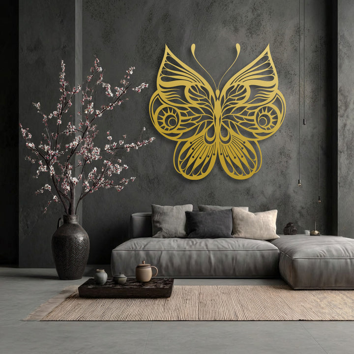 The gritty dark wall contrasts with the lustrous surface of the ornate butterfly unique metal wall art, complemented by a ribbed rug.