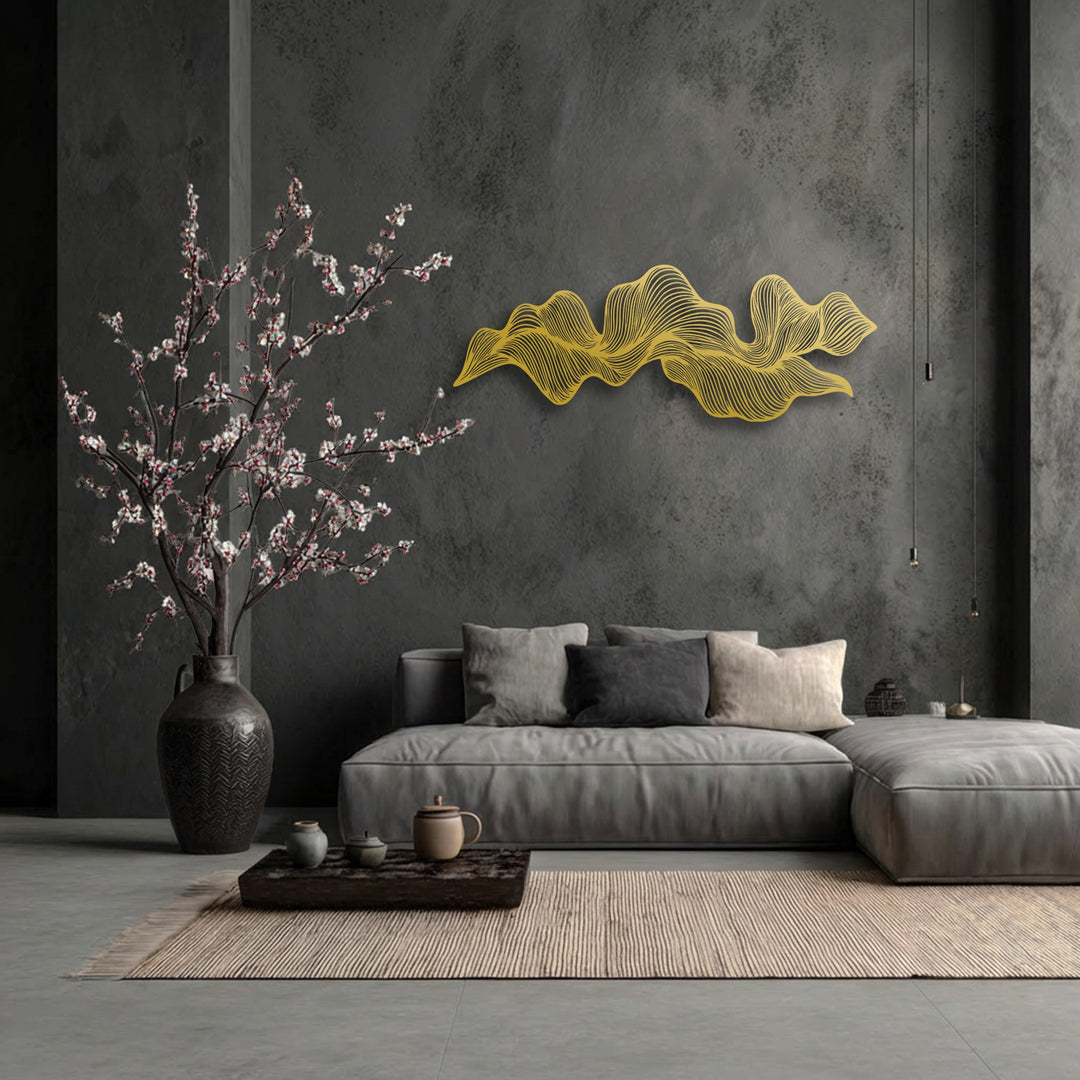 Geometric elements showcase abstract wave flow lines in golden unique metal wall art, forming a modern decorative piece on a charcoal wall.