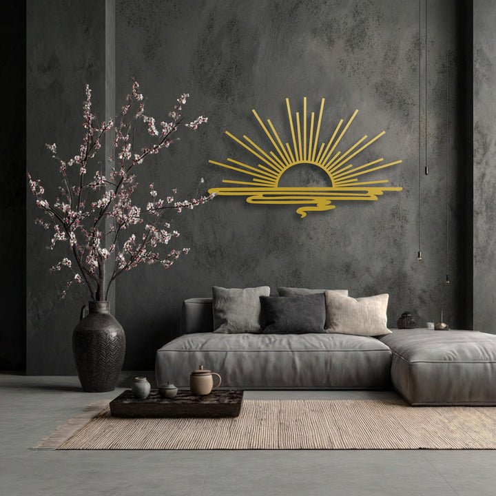 The central subject is a radiant golden minimalist sunrise decorative metal art piece, featuring bold beams over stylized water.