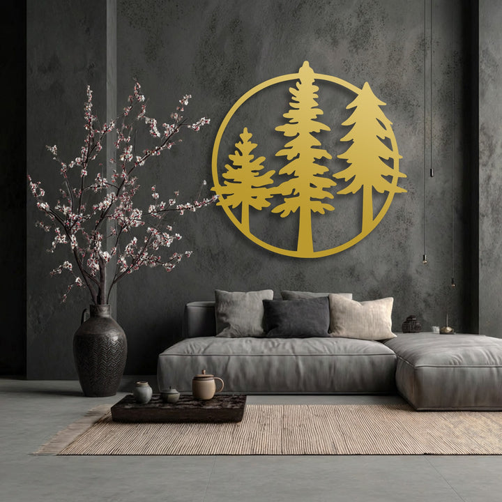 The striking golden circular minimalist forest metal art for wall prominently features evergreen pine tree silhouettes, anchoring the room's decor.