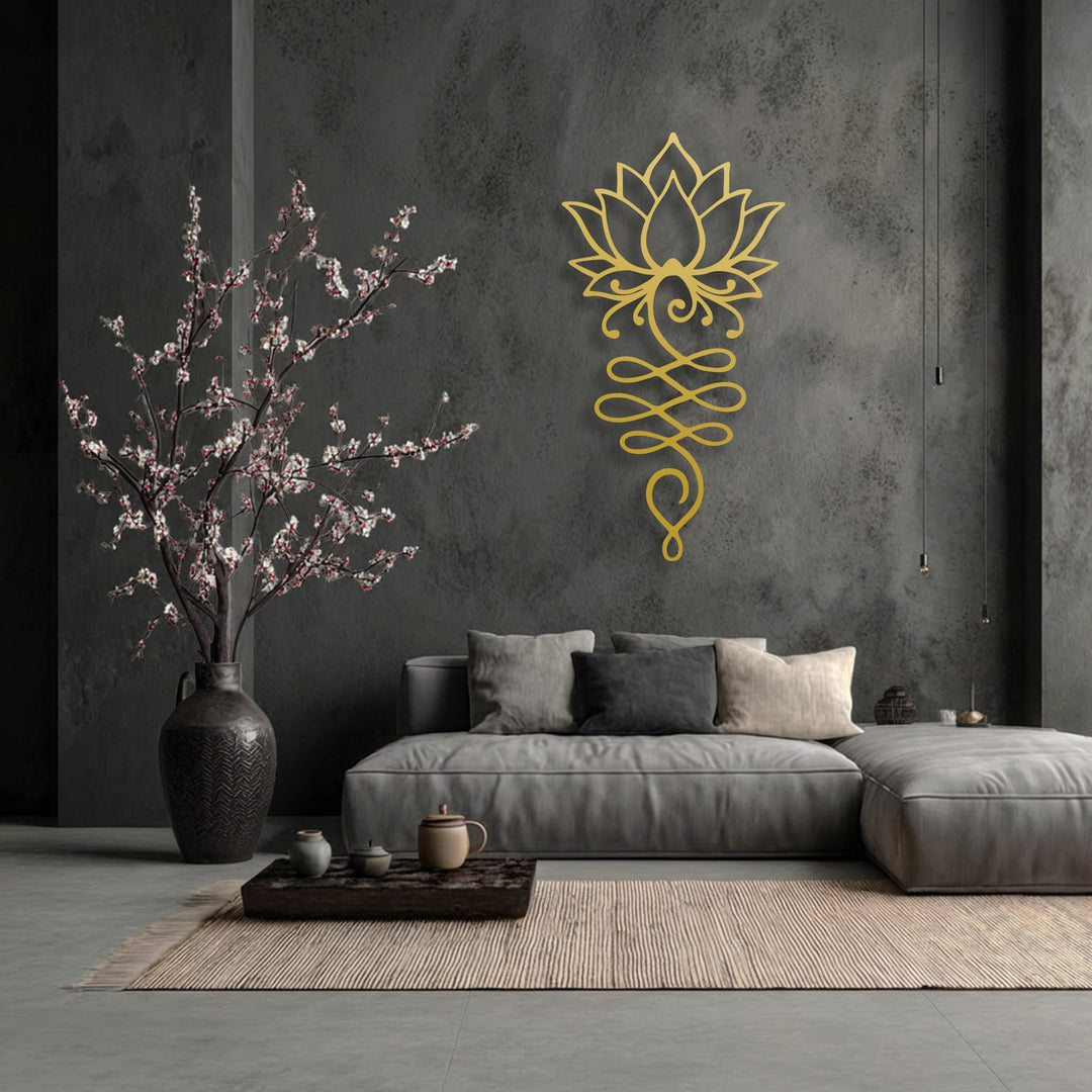 Gritty concrete walls and a ribbed rug complement the smooth, golden finish of the stunning Lotus Flower Symbol metal artwork, adding textural depth.