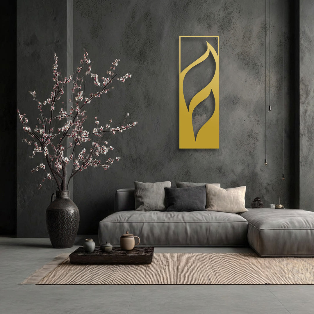The layering effect of the golden flowing leaves metal art for wall creates a distinct minimalist vertical design against the dark, textured wall.