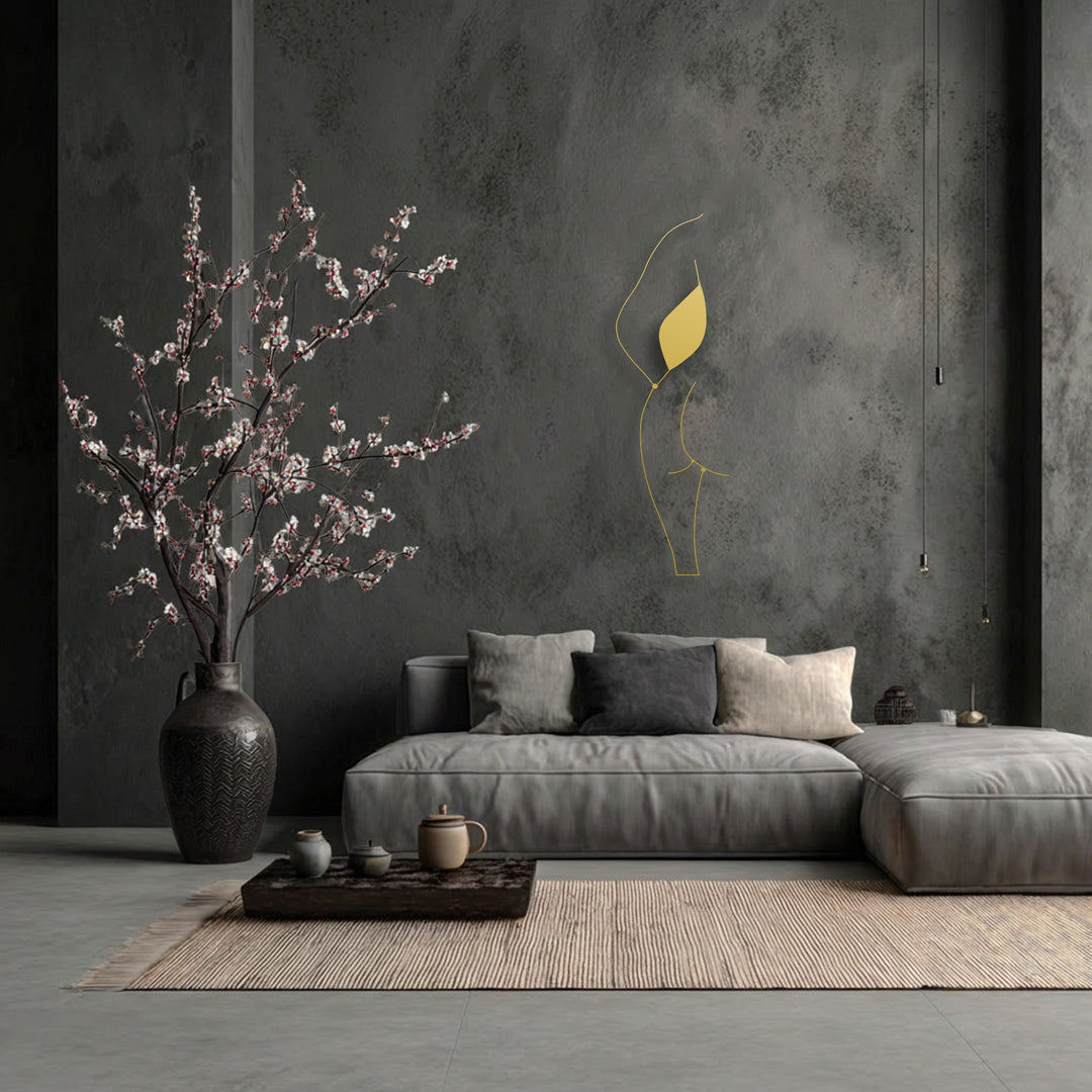 Charcoal grey tones define this modern living space, featuring a minimalist female silhouette line art as stylish decoration wall art.