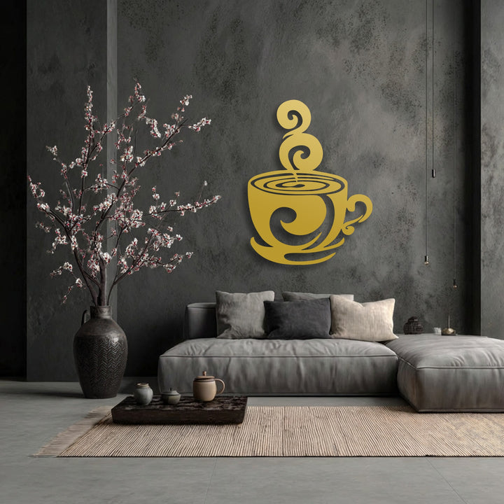 Deep charcoal grey walls frame a golden swirling coffee cup silhouette metal decoration wall art piece above a sofa.