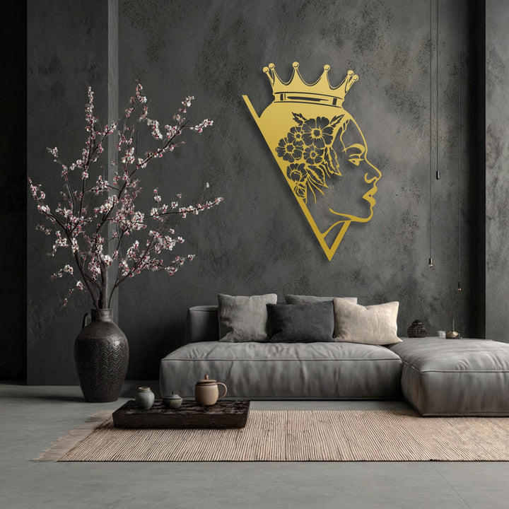 The elegant decorative metal art of a crowned queen with flowing floral details captures a graceful sense of movement.