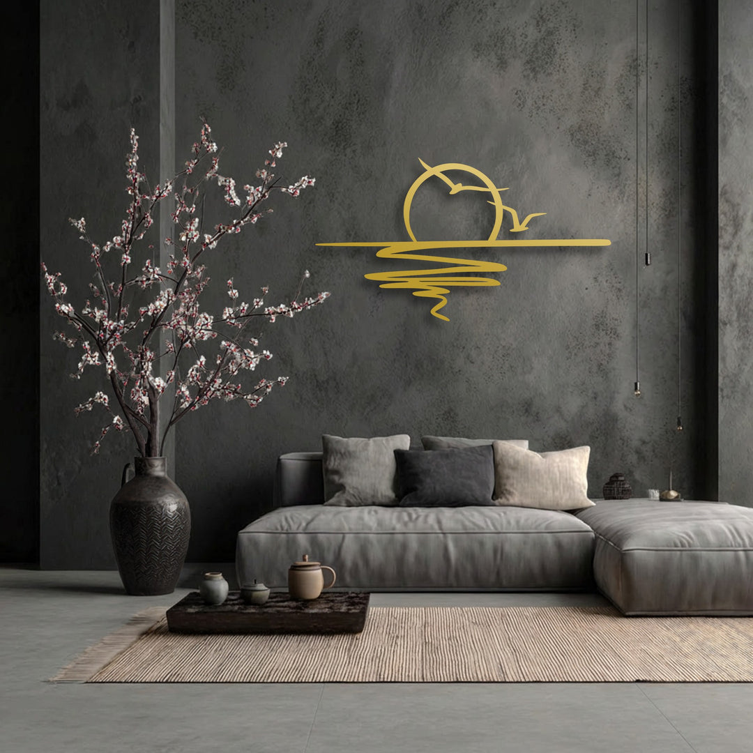 The organic forms of delicate flowering branches complement the flowing lines of the unique metal wall art depicting a minimalist sunset with birds.