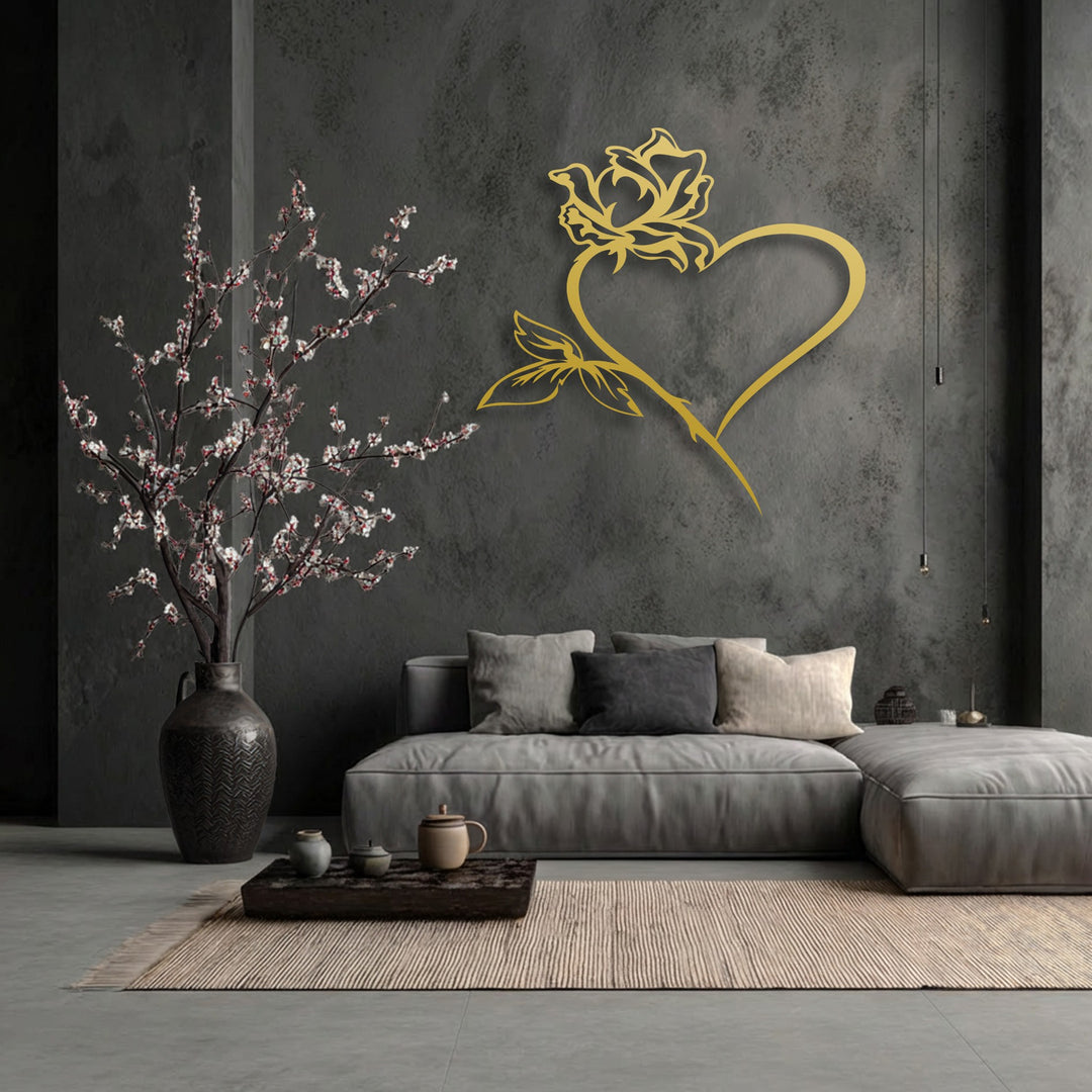 A striking golden rose heart, an intricate piece of metal art for wall, adorns a textured dark gray wall.