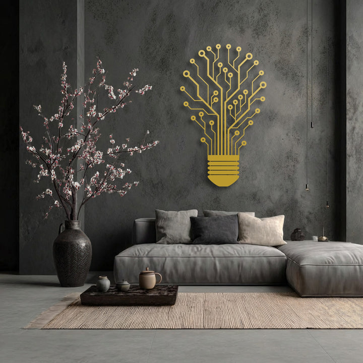 Dark gray walls showcase a striking gold tech tree lightbulb, a unique metal wall art piece, enhancing the modern living room decor.