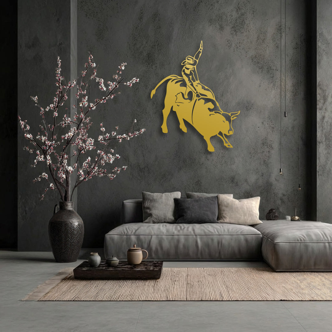 The darkest area, a textured charcoal wall, strikingly features the golden unique metal wall art of a rodeo cowboy on a bucking bull.