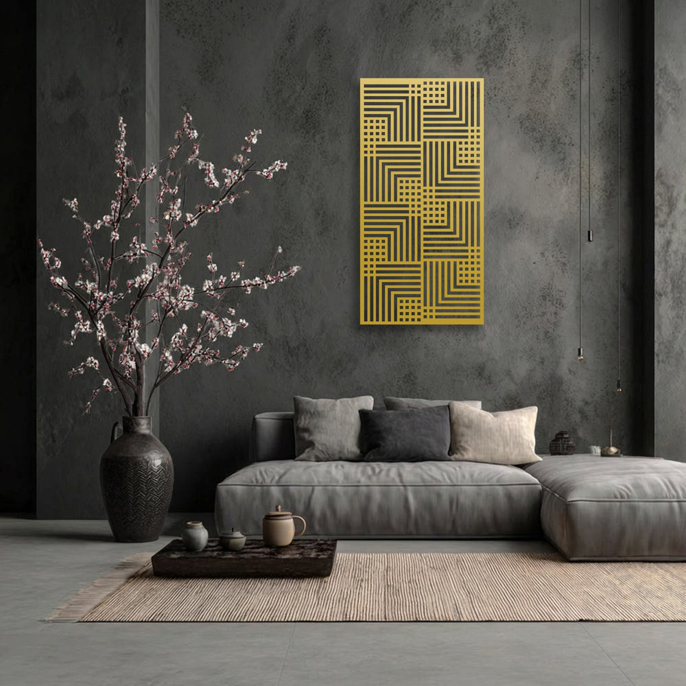 The striking golden geometric patterns of this unique metal wall art create a modern linear pattern, powerfully standing out against the dark wall.