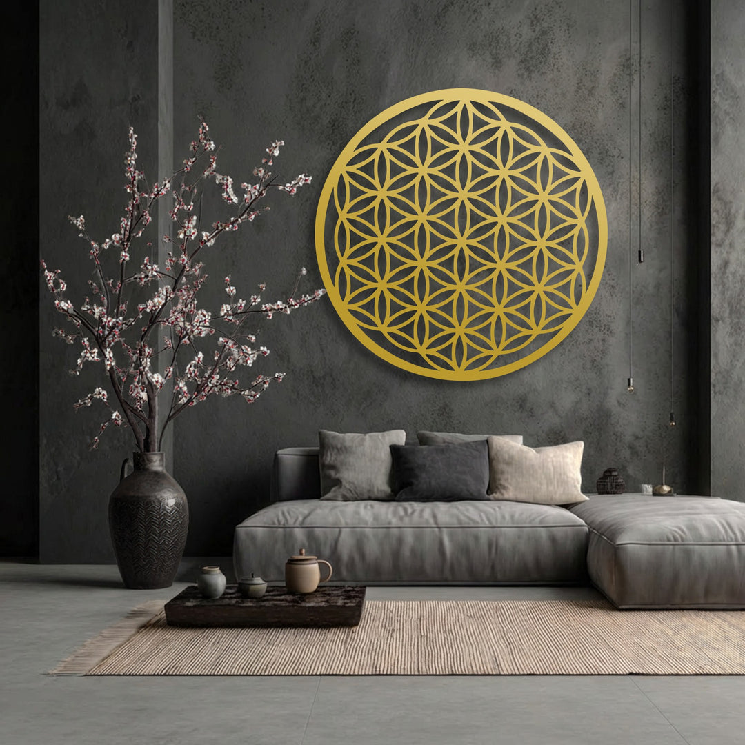Artisanal pottery and blooming cherry branches on a wooden tray beautifully contrast the bold Flower of Life decorative metal art.