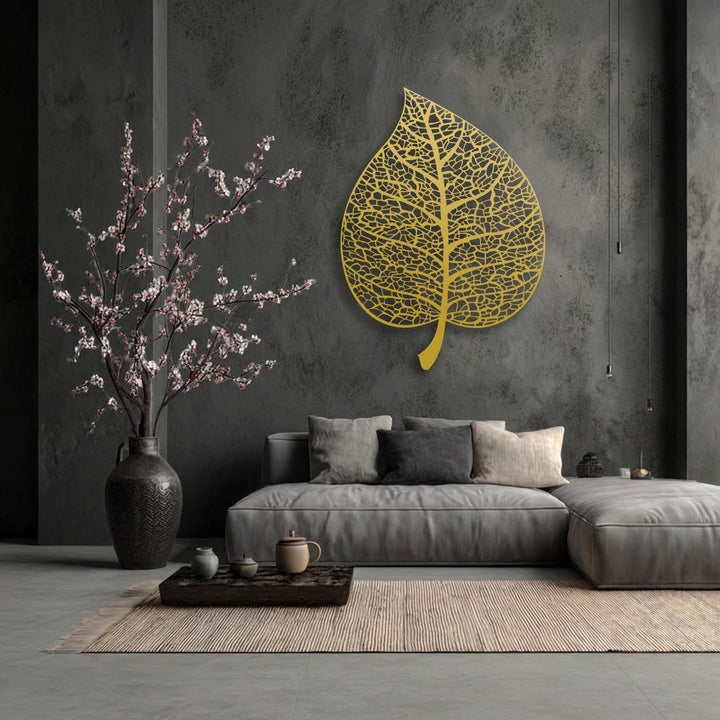 The striking transition between the deep charcoal wall and the luminous golden leaf decoration wall art is complemented by subtle grayscale furniture.