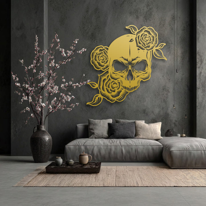 The gothic rose skeleton decorative metal art shines with a warm glow amidst the cool, muted tones of the textured wall art display.