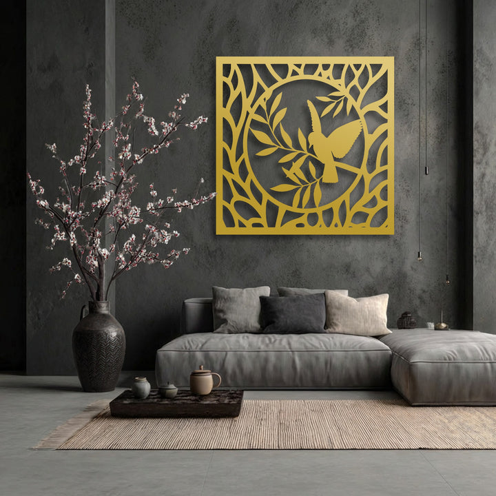 The negative space of the golden decorative metal art sculpts a graceful bird in a nature circle against a deep grey wall.