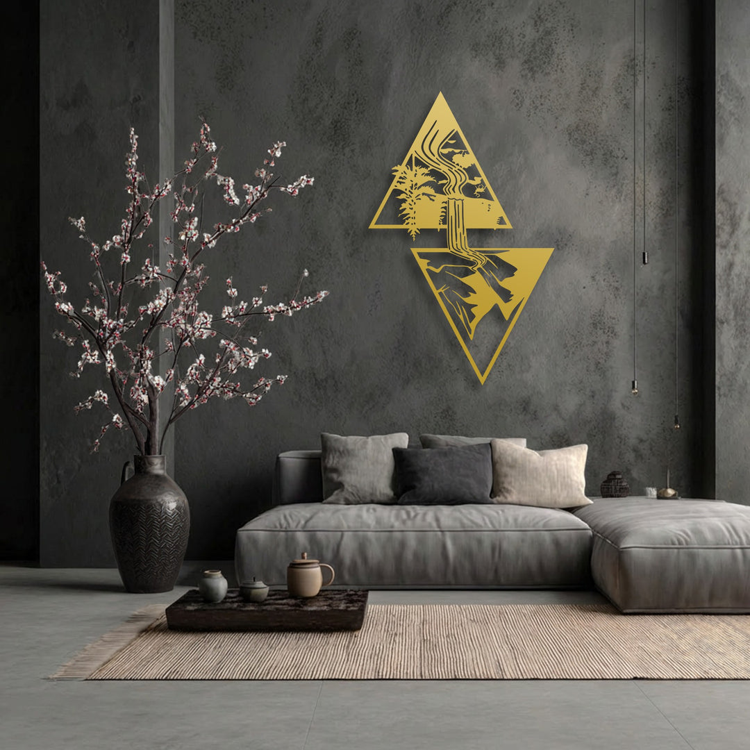 The organic forms of a cascading waterfall and lush trees are meticulously depicted within golden geometric decorative metal art.