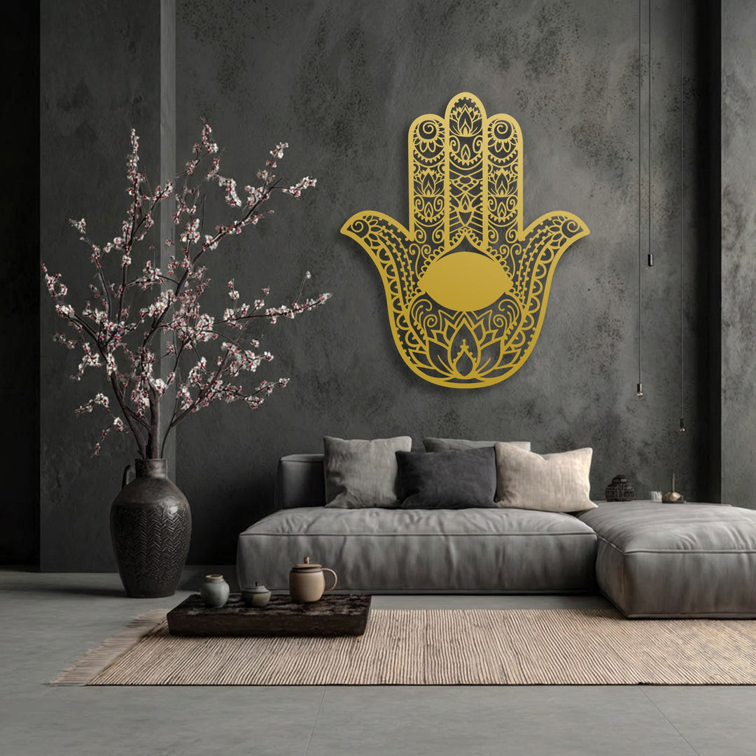 The image showcases a striking contrast in color saturation, with a vibrant golden Hamsa Hand with Evil Eye unique metal wall art against a muted, dark background.