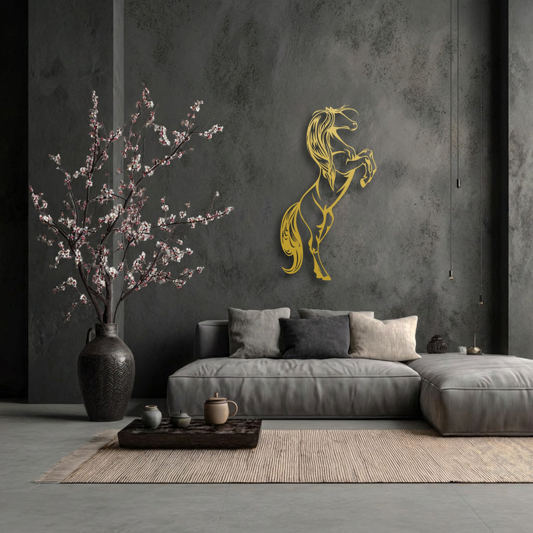 The organic forms of the rearing horse metal artwork and delicate flowering branches create a dynamic and elegant ambiance.