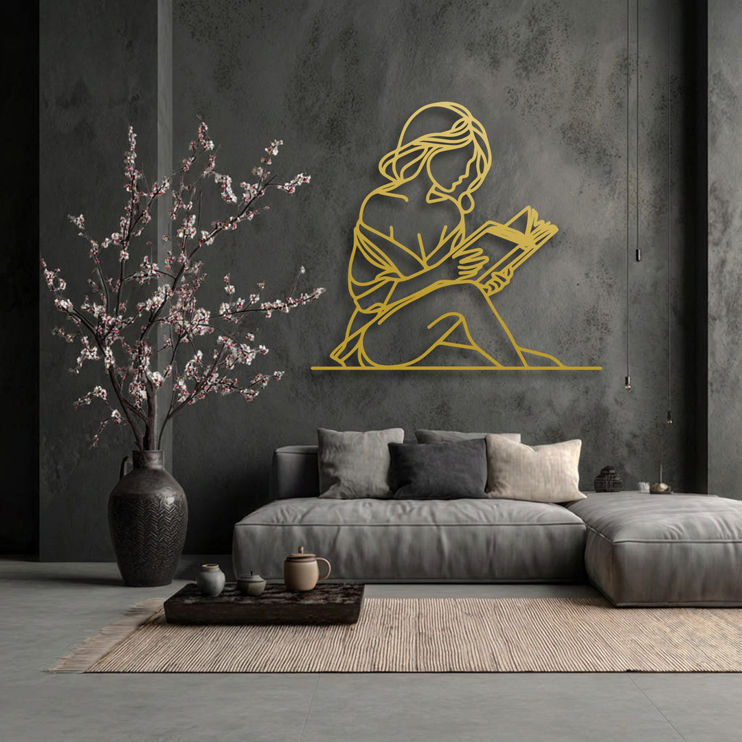 The lustrous golden finish of this minimalist woman silhouette metal decoration wall art creates a striking contrast against the dark wall.