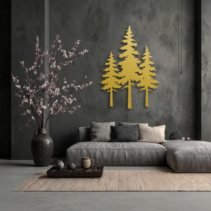 The rough, textured concrete wall behind the smooth, golden pine forest silhouette decorative metal art contrasts with the soft sofa and woven rug.