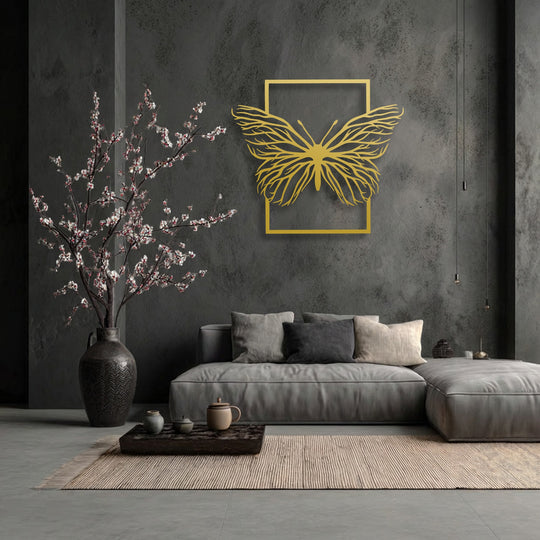The focal point is an elegant golden butterfly within a rectangular frame, serving as striking decoration wall art on a dark, textured wall.