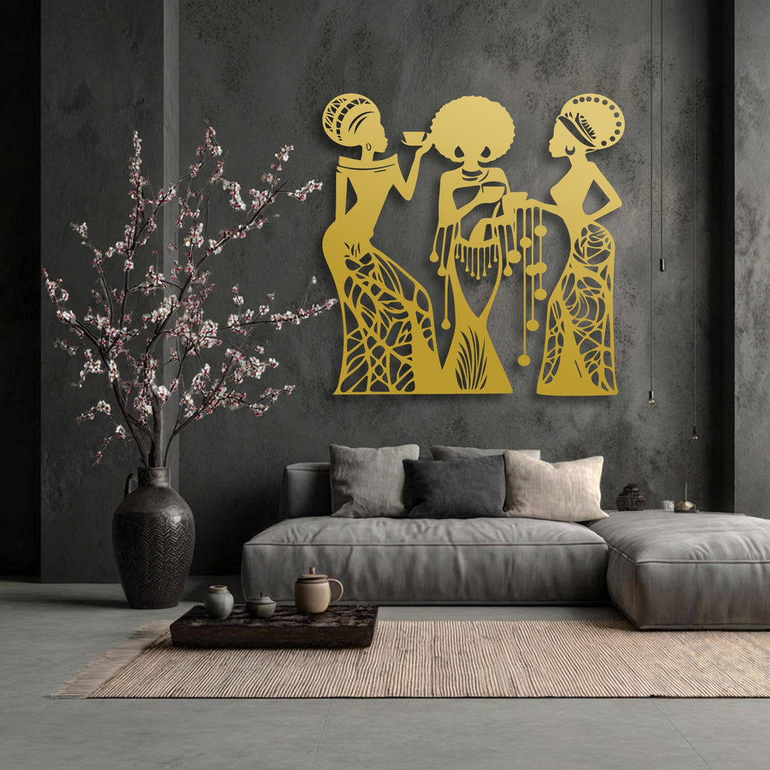 The brightest area highlights the stunning golden couple silhouette metal decoration wall art, featuring three abstract tribal figures in a warm glow.