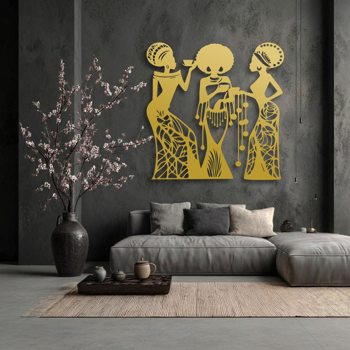 The brightest area highlights the stunning golden couple silhouette metal decoration wall art, featuring three abstract tribal figures in a warm glow.