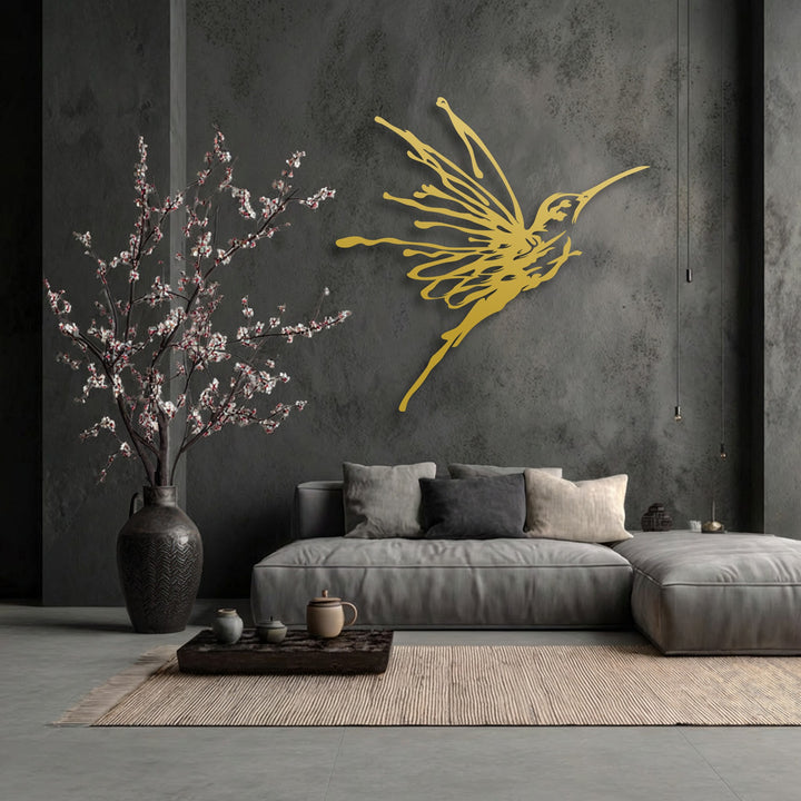 A sophisticated flying hummingbird decorative metal art piece adds striking depth and layers against the textured dark wall.