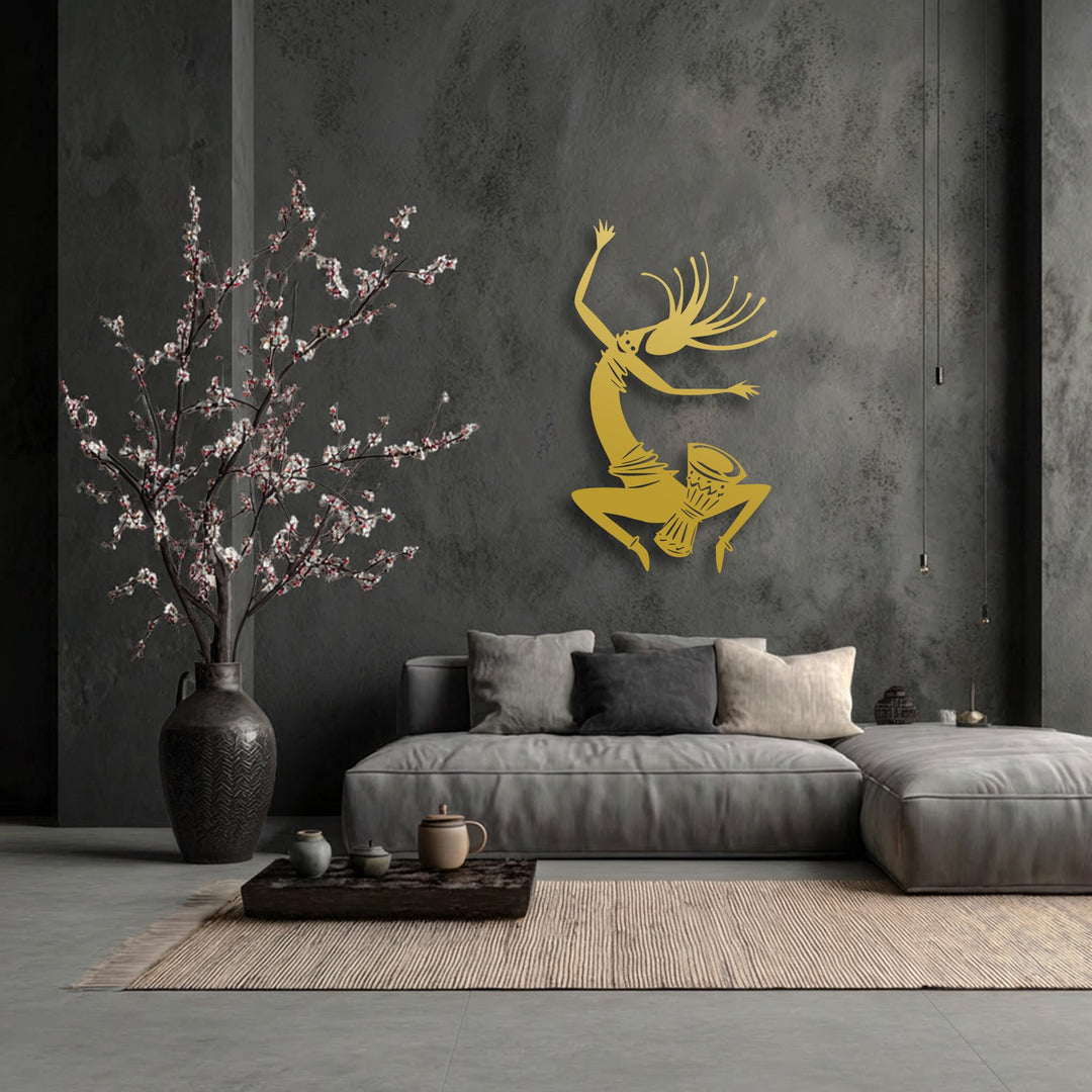 The mood of this contemporary space is vibrant and cultural, highlighted by the dynamic tribal dance silhouette metal artwork.