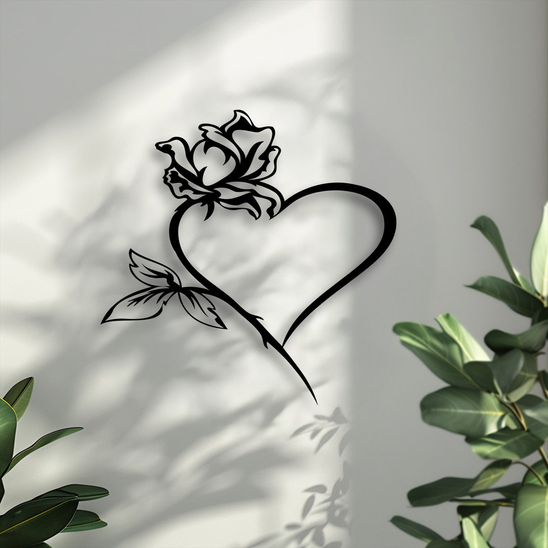 Cool color temperature highlights the distinct black Rose Heart metal artwork, gracefully positioned on a light wall with soft, lengthy shadows.