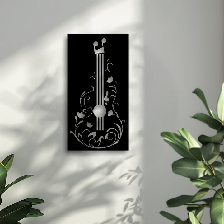 The visual rhythm of this black rectangular floral guitar metal artwork showcases an elegant, music-inspired design with flowing silver patterns and notes.