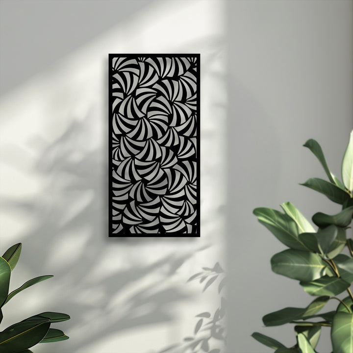 A vertical rectangular metal art for wall panel showcasing an intricate spiral flow abstract geometric pattern on a bright wall.