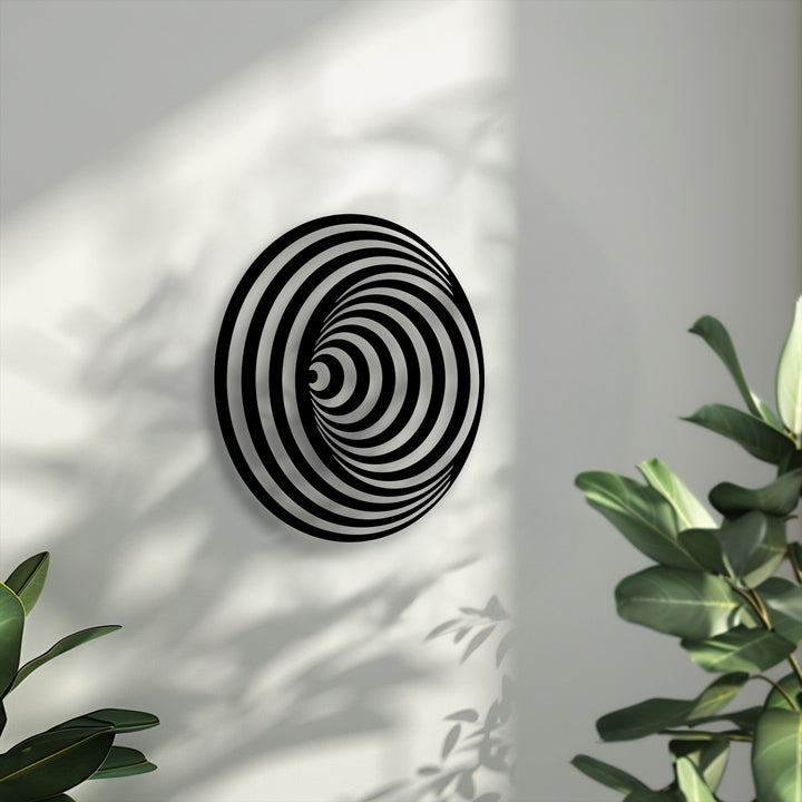 The striking transition between black and white colors forms a hypnotic spiral circle decoration wall art, creating a captivating geometric illusion.