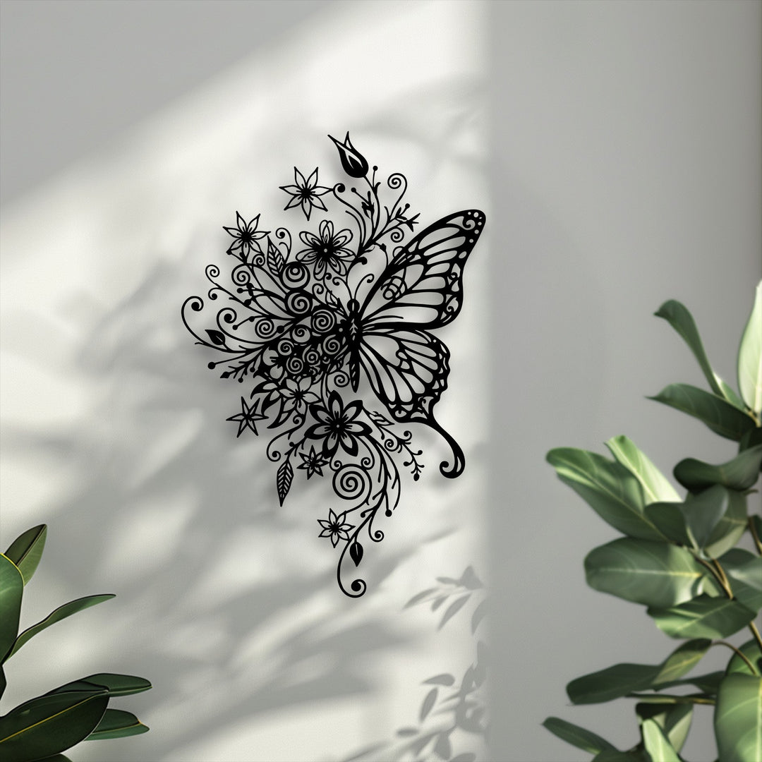 The negative space on the light wall strikingly outlines the delicate black floral butterfly unique metal wall art, enhanced by soft plant shadows.