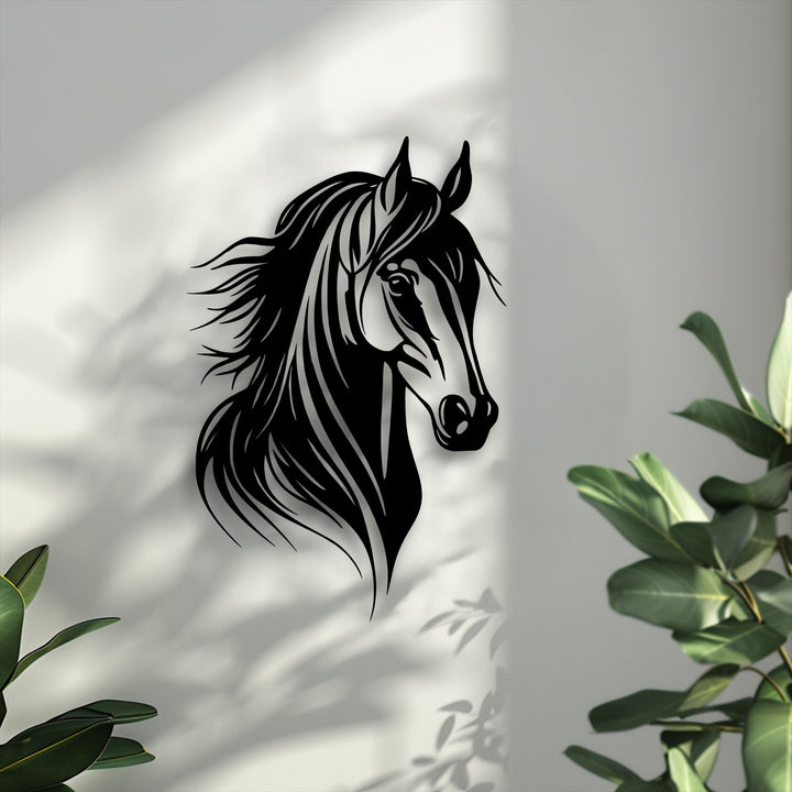 Sunlight creates distinct shadows of leaves and the unique metal wall art of a graceful horse head, enhancing its elegant contours.