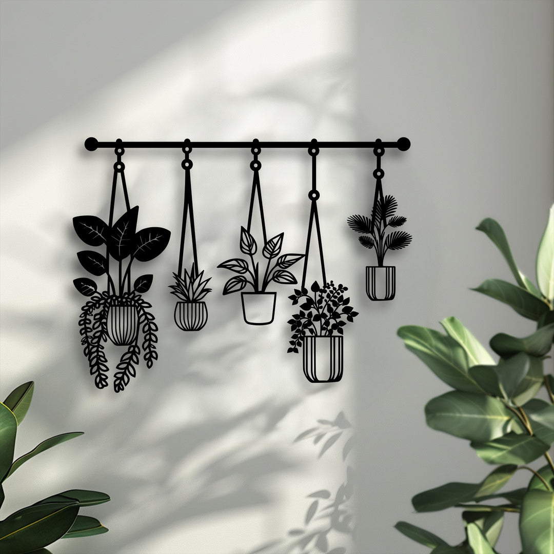Crisp, cool color temperature highlights the intricate hanging plants metal artwork, a modern botanical decor piece on a textured white wall.