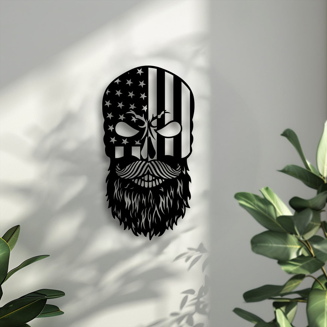 The negative space on a textured white wall highlights the striking black bearded American flag skull decorative metal art with intricate leaf shadows.