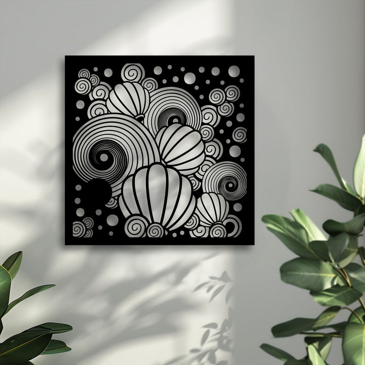 The darkest area reveals intricate silver spirals and segmented balloon shapes on a striking black abstract metal wall decor.