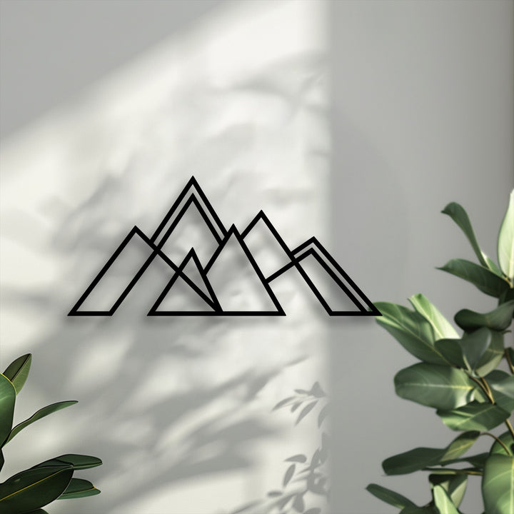 Highlighting the multi-layered depth of this geometric mountain metal artwork, its intersecting lines and distinct shadows add rich dimension.