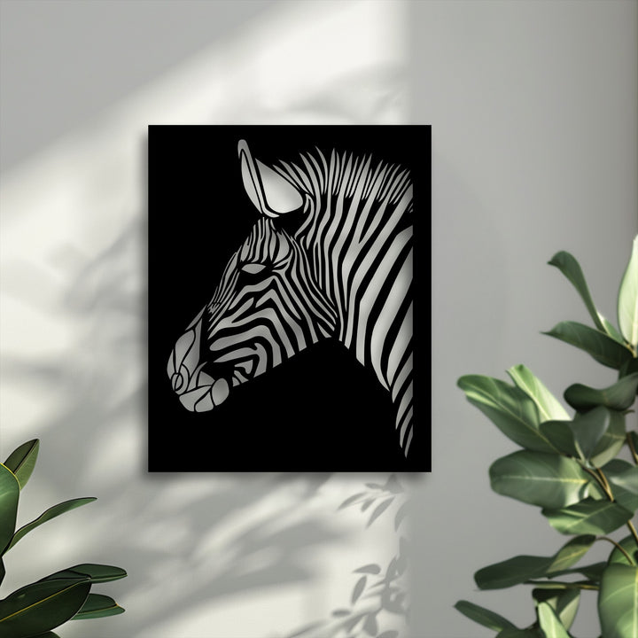 The abstract quality of the zebra's simplified, high-contrast stripes defines this unique metal wall art, creating a modern silhouette.