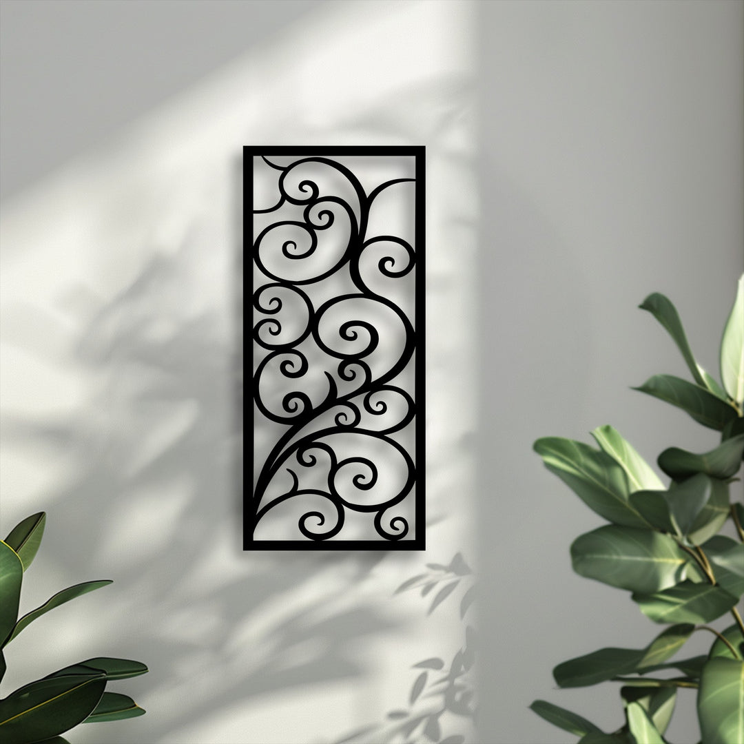 Stillness permeates the scene as subtle light and organic shadows beautifully highlight the elegant scroll pattern metal wall decor.
