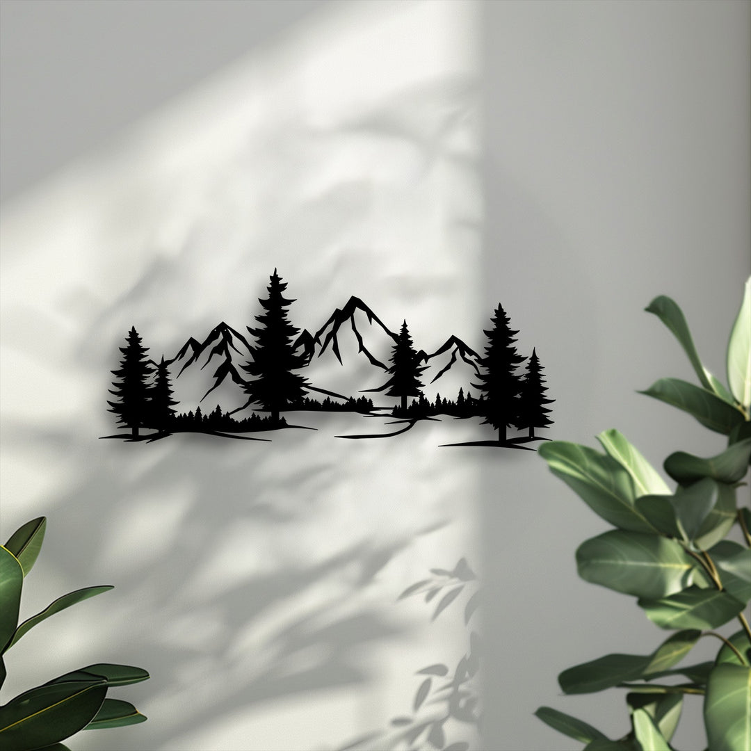 The brilliantly lit wall features distinct natural shadows, highlighting the black Evergreen Peaks mountain forest metal wall decor.