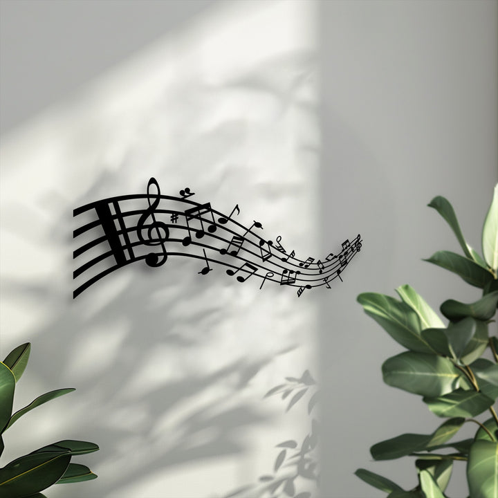 The sleek, clean borders of this modern metal artwork distinctly outline the flowing musical notes and elegant treble clef.