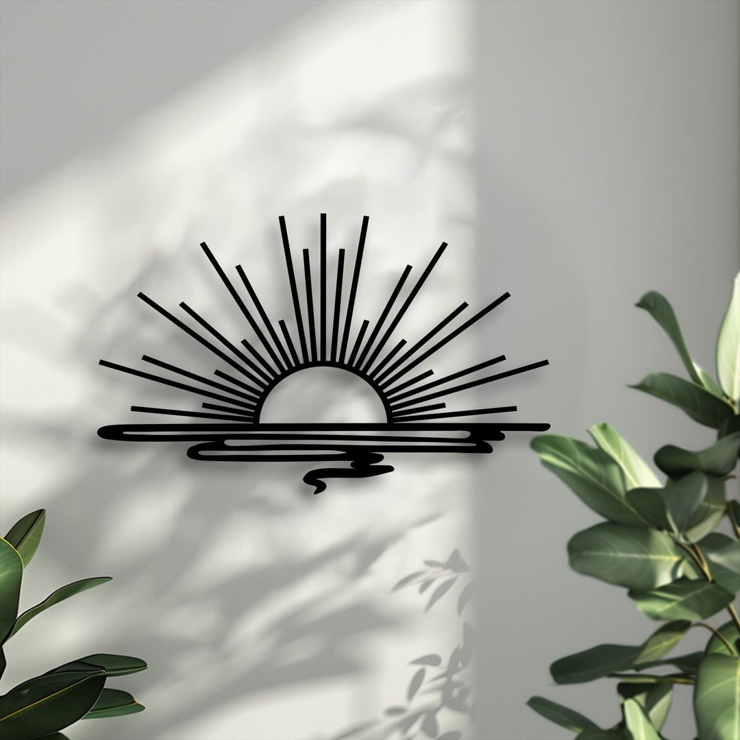 A textured white wall, softly illuminated with shadows from foliage, creates a peaceful setting for the elegant Minimalist Sunrise metal artwork.